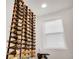 Stylish wine storage with a large rack, adjacent to a bright window creates an elegant and functional display feature at 14998 Cast Pebble Cir, Parker, CO 80134
