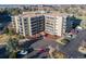 Aerial view of the building featuring a well-maintained parking lot, landscaping, and balcony views at 13901 E Marina Dr # 113, Aurora, CO 80014