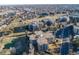 Aerial view showcasing the community, golf course, and surrounding landscape at 13901 E Marina Dr # 113, Aurora, CO 80014