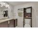 Bathroom featuring vanity with sink, granite countertops, and convenient cabinet storage at 13901 E Marina Dr # 113, Aurora, CO 80014