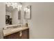 Modern bathroom vanity with stylish lighting and granite countertop providing efficient storage at 13901 E Marina Dr # 113, Aurora, CO 80014