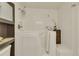 Accessible bathroom featuring a walk-in bathtub with white tile surround, plus additional storage space at 13901 E Marina Dr # 113, Aurora, CO 80014