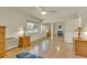 Sunlit bedroom with hardwood floors, mirrored closet doors, and a large window for natural light at 13901 E Marina Dr # 113, Aurora, CO 80014