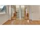 Bright bedroom featuring large closet with mirrored doors, a window with a view, and parquet wood floors at 13901 E Marina Dr # 113, Aurora, CO 80014