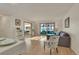 Inviting living room with hardwood floors, and large sliding glass doors leading to a sunroom at 13901 E Marina Dr # 113, Aurora, CO 80014