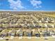 Expansive aerial view of a residential neighborhood showcasing similar homes and the beautiful landscape at 885 Hearthstone Ave, Brighton, CO 80601
