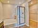 Bathroom features a soaking tub, shower with glass door, and walk-in closet at 885 Hearthstone Ave, Brighton, CO 80601