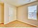 Neutral bedroom with closet and window at 885 Hearthstone Ave, Brighton, CO 80601