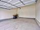 Spacious garage with concrete floors, ample room for parking and storage space at 885 Hearthstone Ave, Brighton, CO 80601