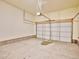 Spacious garage with concrete floors, ample room for parking and storage space at 885 Hearthstone Ave, Brighton, CO 80601