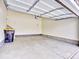 Spacious garage with concrete floors, ample room for parking and storage space at 885 Hearthstone Ave, Brighton, CO 80601