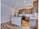 Open kitchen with stainless appliances, island, plenty of cabinet space and natural light at 885 Hearthstone Ave, Brighton, CO 80601