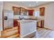 Well-lit kitchen features stainless steel appliances, granite countertops, and an island at 885 Hearthstone Ave, Brighton, CO 80601