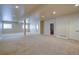 Spacious finished basement with neutral carpet, multiple windows, and recessed lighting at 14993 W 55Th Dr, Golden, CO 80403