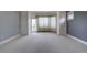 Serene bedroom featuring large windows, plush carpeting, and ample natural light at 14993 W 55Th Dr, Golden, CO 80403