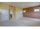 Bedroom with neutral carpet, multiple windows, and two-tone paint at 14993 W 55Th Dr, Golden, CO 80403