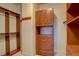 Walk-in closet featuring custom shelving, drawers, and ample storage space at 14993 W 55Th Dr, Golden, CO 80403