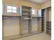 Well-organized walk-in closet with built-in shelves and natural light at 14993 W 55Th Dr, Golden, CO 80403
