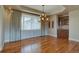 Charming dining area with ample light, hardwood floors, and built in bar at 14993 W 55Th Dr, Golden, CO 80403