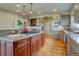 Gourmet kitchen showcasing custom cabinets, granite countertops, and modern stainless appliances at 14993 W 55Th Dr, Golden, CO 80403