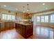 Well-appointed kitchen featuring custom island and a bright breakfast nook at 14993 W 55Th Dr, Golden, CO 80403
