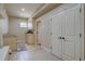 Laundry room area with tile floors, storage cabinets and access to the rest of the home at 14993 W 55Th Dr, Golden, CO 80403