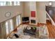 Open-concept living room with fireplace and floor-to-ceiling windows at 14993 W 55Th Dr, Golden, CO 80403