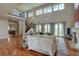 Bright living room boasting high ceilings, hardwood floors, and abundant natural light at 14993 W 55Th Dr, Golden, CO 80403