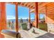 Picturesque deck featuring outdoor dining area with seating and beautiful mountain views at 11450 Marks Dr, Conifer, CO 80433