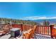 Deck with mountain view, seating, and wooden railing perfect for outdoor entertaining and relaxation at 11450 Marks Dr, Conifer, CO 80433