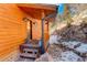 Charming front porch with log accents and a welcoming entrance at 11450 Marks Dr, Conifer, CO 80433