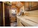 Convenient laundry room featuring front-loading washer and dryer, storage cabinets, and a window with a view at 11450 Marks Dr, Conifer, CO 80433