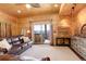 Cozy living room with hot tub access, comfortable seating, and mountain views at 11450 Marks Dr, Conifer, CO 80433