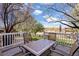 Spacious back deck with outdoor seating, a grill, and views of the landscaped backyard at 5941 S Waco St, Aurora, CO 80016