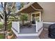 Back deck with awning features outdoor seating and access to the backyard at 5941 S Waco St, Aurora, CO 80016