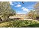 Expansive backyard features lush green grass, a cozy seating area, and picturesque views of open space, perfect for relaxation at 5941 S Waco St, Aurora, CO 80016