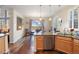 Bright kitchen with stainless steel appliances, granite countertops, and hardwood floors at 5941 S Waco St, Aurora, CO 80016