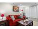 Relaxing living room with an oversized comfortable couch, coffee table, lamps, and neutral decor at 5941 S Waco St, Aurora, CO 80016