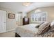 Main bedroom with large window and plantation shutters is spacious and airy at 5941 S Waco St, Aurora, CO 80016