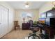 Bright and airy office featuring a desk, chair, closet and window with plantation shutters at 5941 S Waco St, Aurora, CO 80016