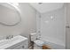 Bathroom featuring a tiled shower/tub, new fixtures and vanity at 1050 Uvalda St, Aurora, CO 80011