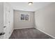 Bright bedroom with new carpet, large window, and neutral wall paint at 1050 Uvalda St, Aurora, CO 80011