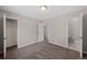 Bedroom featuring neutral walls, carpet floors, closet and an attached half bath at 1050 Uvalda St, Aurora, CO 80011