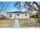 Charming single-story home with a welcoming walkway and a convenient carport at 1050 Uvalda St, Aurora, CO 80011