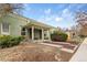Charming home featuring a covered porch with tasteful landscaping and a well-maintained lawn at 3034 N High St, Denver, CO 80205