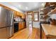 Modern kitchen with stainless steel refrigerator and ample counter space at 3034 N High St, Denver, CO 80205