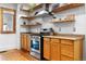 Close-up of the kitchen featuring modern stainless steel oven and hood at 3034 N High St, Denver, CO 80205