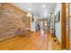 Spacious living area boasting exposed brick, hardwood floors, and stylish decor at 3034 N High St, Denver, CO 80205