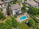 A backyard oasis with a beautiful swimming pool, outdoor seating, fire pit, and lush green lawn at 10057 S Shadow Hill Dr, Lone Tree, CO 80124