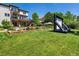 Spacious backyard with a pool, an outdoor lounge area, and an inflatable movie screen at 10057 S Shadow Hill Dr, Lone Tree, CO 80124